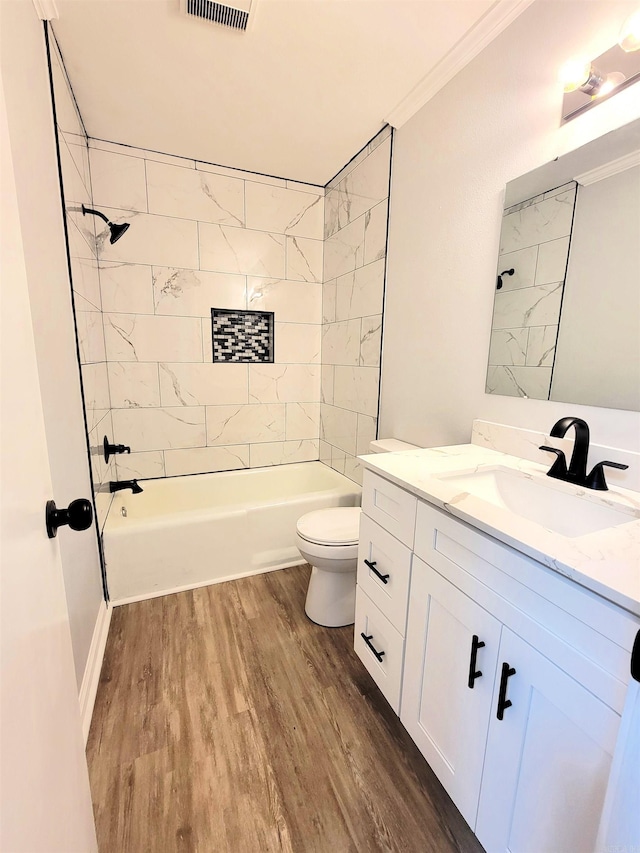 1907 Sunset, Pine Bluff, AR 71603 - full bath featuring wood finished floors, vanity, toilet, crown molding, and shower / bathtub combination