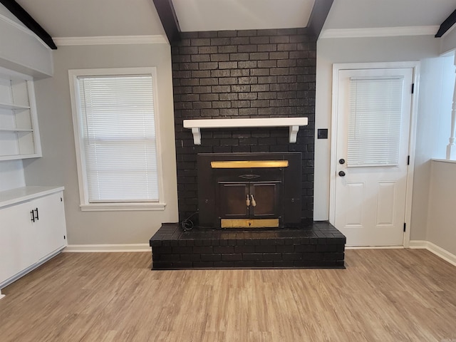 1907 Sunset, Pine Bluff, AR 71603 - unfurnished living room featuring wood finished floors, baseboards, crown molding, a fireplace, and plenty of natural light