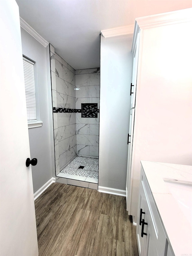 1907 Sunset, Pine Bluff, AR 71603 - bathroom featuring wood finished floors, a stall shower, baseboards, and ornamental molding