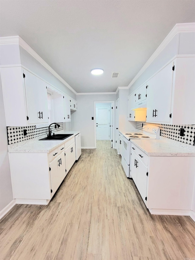 1907 Sunset, Pine Bluff, AR 71603 - kitchen featuring a sink, white appliances, light wood-style flooring, under cabinet range hood, and light countertops