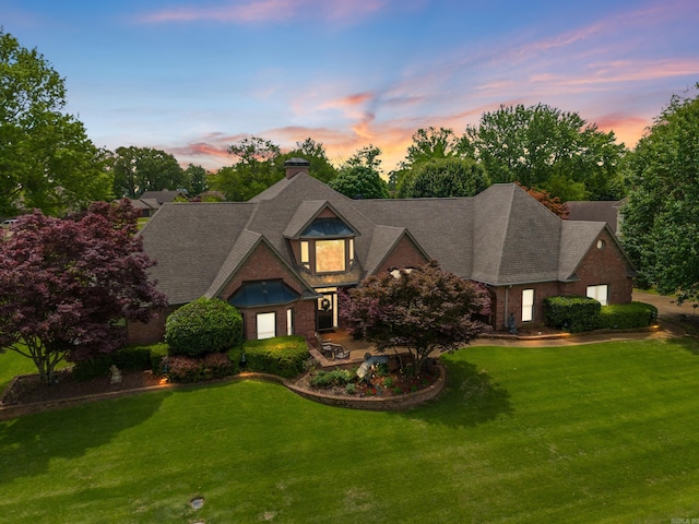 852 Rock Ledge Rd, Heber Springs, AR 72543 - view of front facade featuring a lawn, brick siding, and a chimney