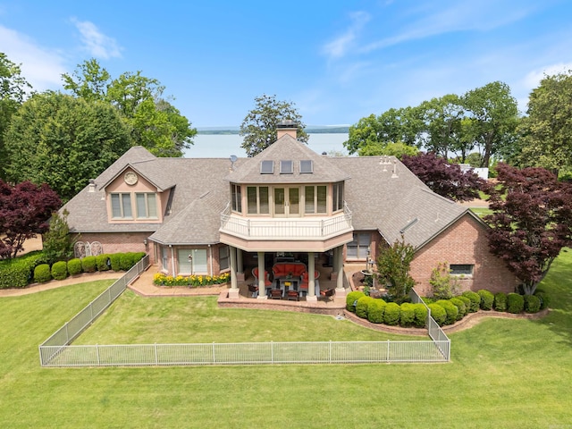 852 Rock Ledge Rd, Heber Springs, AR 72543 - view of front facade with a patio, a water view, roof with shingles, and brick siding