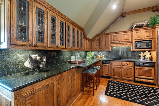 852 Rock Ledge Rd, Heber Springs, AR 72543 - kitchen featuring black microwave, brown cabinets, paneled dishwasher, glass insert cabinets, and lofted ceiling