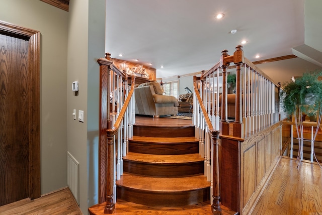 852 Rock Ledge Rd, Heber Springs, AR 72543 - stairway featuring wood finished floors, recessed lighting, and crown molding