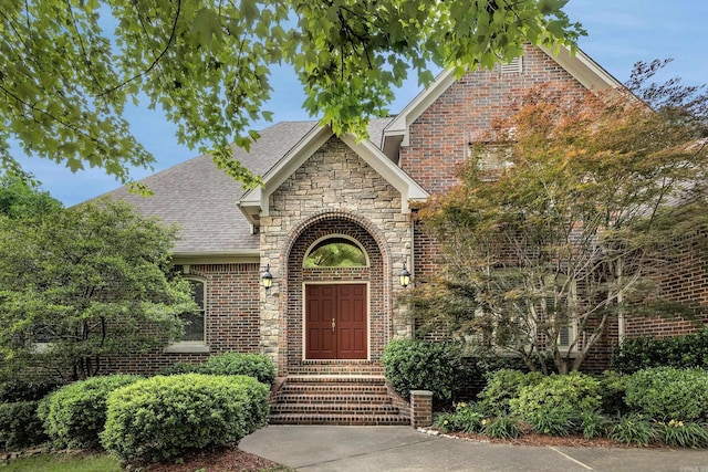 6 Frecourt Ln, Little Rock, AR 72223 - view of front of home featuring roof with shingles, brick siding, and stone siding