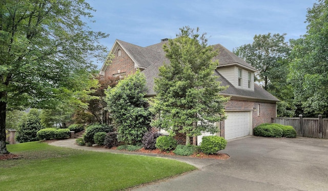 6 Frecourt Ln, Little Rock, AR 72223 - view of property exterior featuring brick siding, concrete driveway, roof with shingles, and a garage