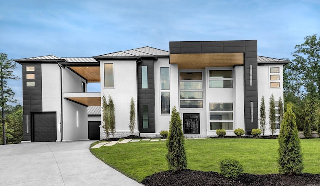 contemporary home featuring a standing seam roof and metal roof