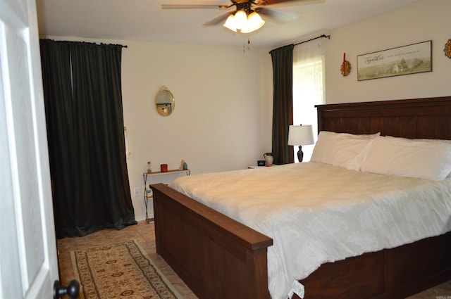 1059 Piney Rd, De Queen, AR 71832 - bedroom with light tile patterned floors and ceiling fan