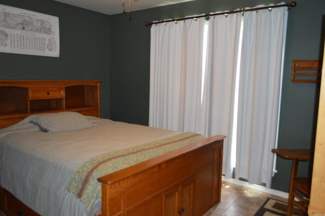 1059 Piney Rd, De Queen, AR 71832 - bedroom with light tile patterned flooring and baseboards