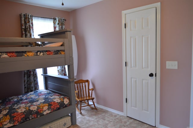 1059 Piney Rd, De Queen, AR 71832 - bedroom featuring baseboards and light tile patterned floors