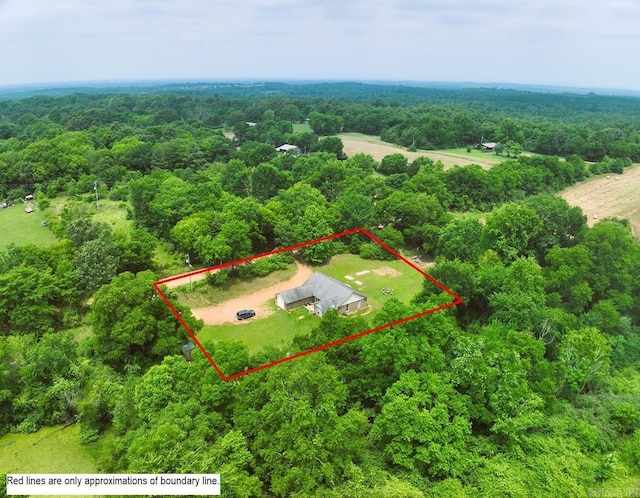1059 Piney Rd, De Queen, AR 71832 - aerial view of property and surrounding area with a heavily wooded area and property parcel outlined