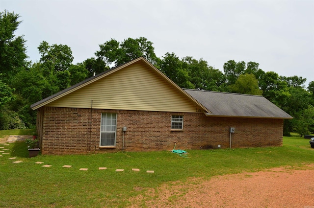 1059 Piney Rd, De Queen, AR 71832 - view of side of property featuring a yard and brick siding