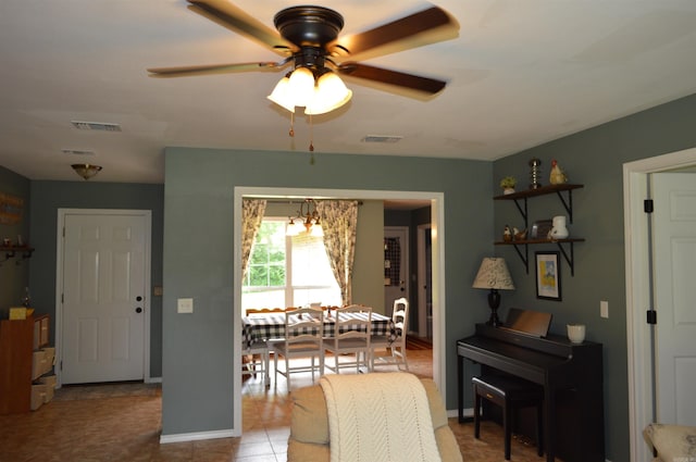 1059 Piney Rd, De Queen, AR 71832 - dining room with ceiling fan, a chandelier, and baseboards