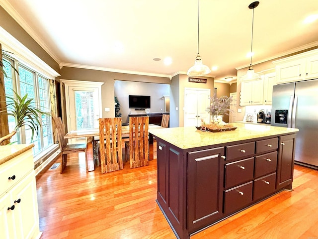 14 Windrush Pt, Little Rock, AR 72211 - kitchen with stainless steel fridge, white cabinets, light wood-type flooring, crown molding, and light stone counters