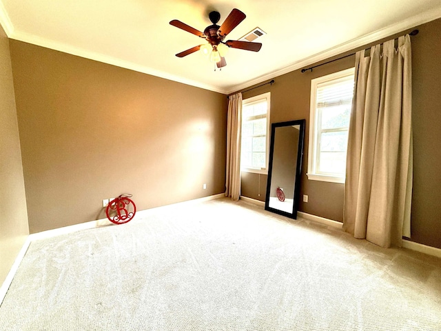 14 Windrush Pt, Little Rock, AR 72211 - spare room featuring crown molding, baseboards, a ceiling fan, and carpet flooring