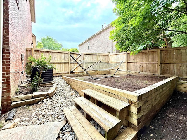 14 Windrush Pt, Little Rock, AR 72211 - fenced backyard with a garden