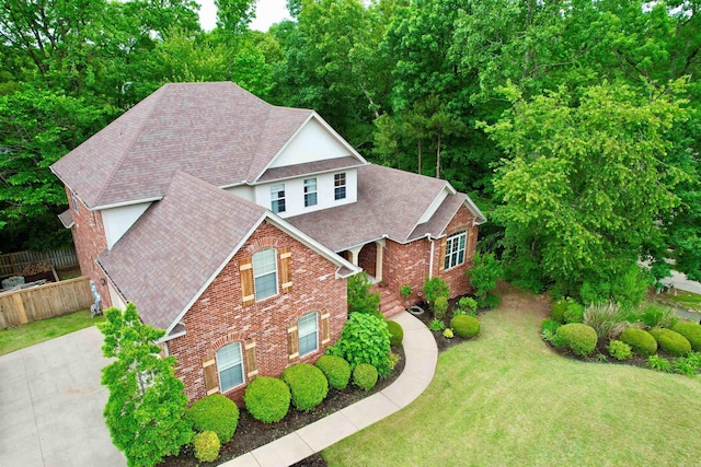 14 Windrush Pt, Little Rock, AR 72211 - traditional home with roof with shingles and brick siding