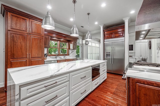 12 Darro Way, Hot Springs Village, AR 71909 - kitchen with stainless steel appliances, ornamental molding, wall chimney range hood, light stone counters, and dark wood-type flooring