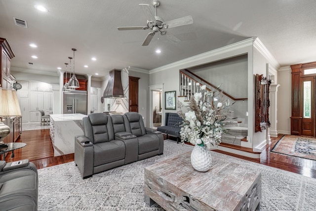 12 Darro Way, Hot Springs Village, AR 71909 - living room with stairway, ornamental molding, wood finished floors, a ceiling fan, and baseboards