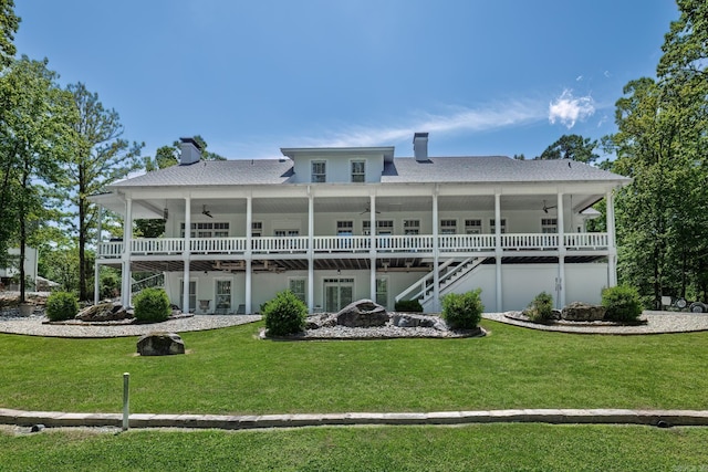 12 Darro Way, Hot Springs Village, AR 71909 - back of house featuring ceiling fan, a chimney, and a lawn