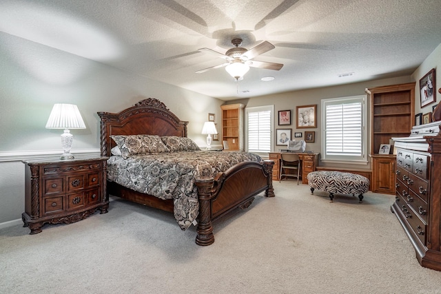 12 Darro Way, Hot Springs Village, AR 71909 - bedroom with light colored carpet, a textured ceiling, and a ceiling fan