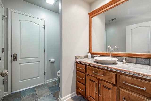 12 Darro Way, Hot Springs Village, AR 71909 - bathroom featuring toilet, vanity, and baseboards