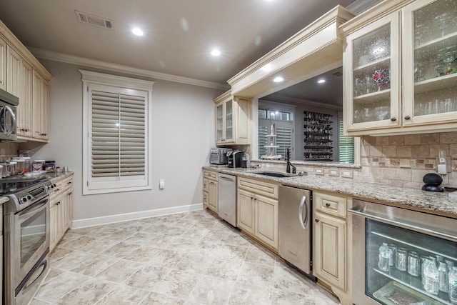 12 Darro Way, Hot Springs Village, AR 71909 - kitchen featuring stainless steel appliances, wine cooler, a sink, crown molding, and cream cabinetry