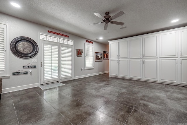 12 Darro Way, Hot Springs Village, AR 71909 - garage featuring a ceiling fan, baseboards, and recessed lighting