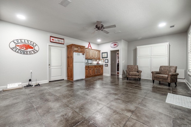 12 Darro Way, Hot Springs Village, AR 71909 - living room featuring ceiling fan, baseboards, concrete flooring, recessed lighting, and a textured ceiling