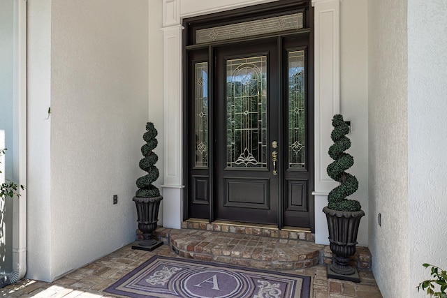 12 Darro Way, Hot Springs Village, AR 71909 - property entrance with stucco siding and a porch