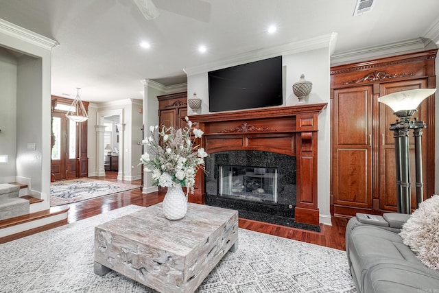 12 Darro Way, Hot Springs Village, AR 71909 - living area with ornamental molding, wood finished floors, a fireplace, baseboards, and recessed lighting