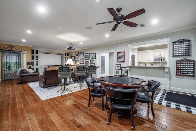 12 Darro Way, Hot Springs Village, AR 71909 - dining area featuring wood-type flooring, recessed lighting, ornamental molding, and ceiling fan