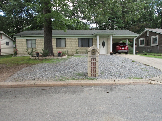4005 Arapaho Trl, Little Rock, AR 72209 - ranch-style house featuring brick siding, driveway, and a carport