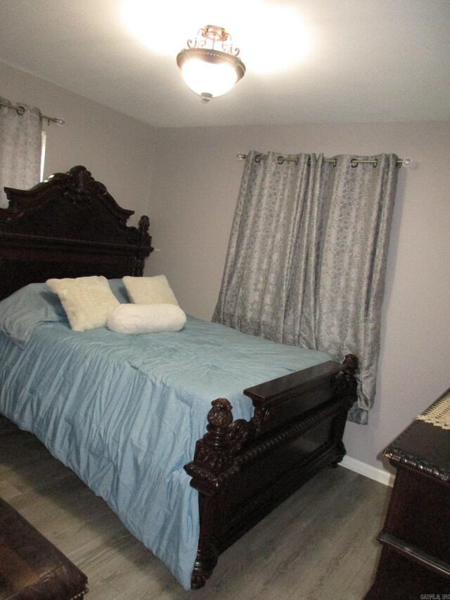 4005 Arapaho Trl, Little Rock, AR 72209 - bedroom with wood finished floors and baseboards
