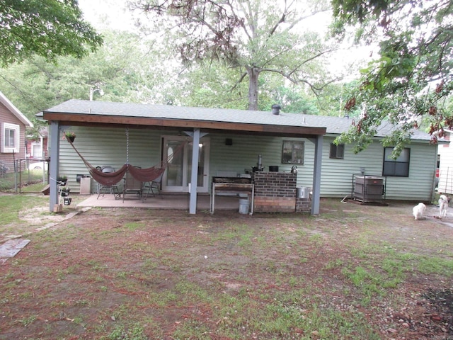 4005 Arapaho Trl, Little Rock, AR 72209 - back of house featuring a patio area and fence
