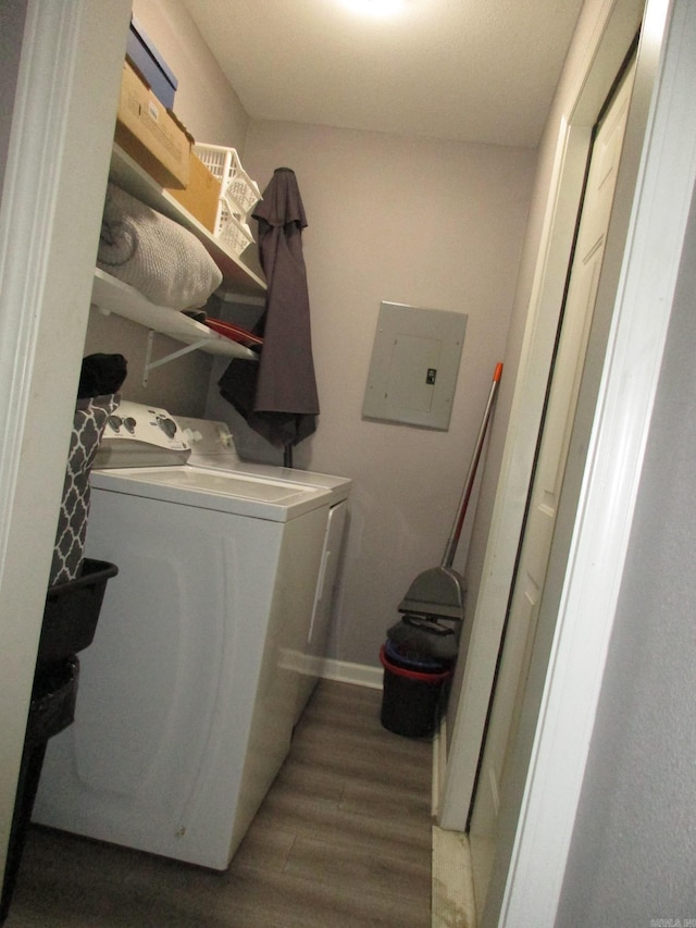 4005 Arapaho Trl, Little Rock, AR 72209 - washroom featuring electric panel, washing machine and dryer, light wood-style floors, and baseboards