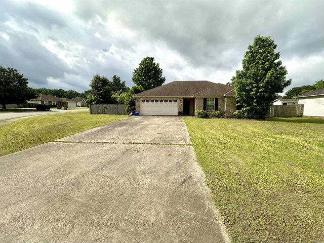 ranch-style house featuring concrete driveway and a garage