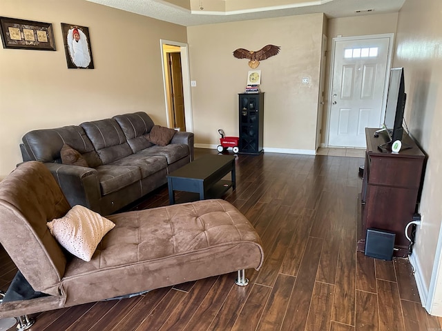 living area featuring wood finished floors and baseboards