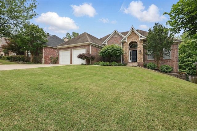 15 Challain Cv, Little Rock, AR 72223 - view of front facade featuring brick siding, driveway, a garage, and a front yard