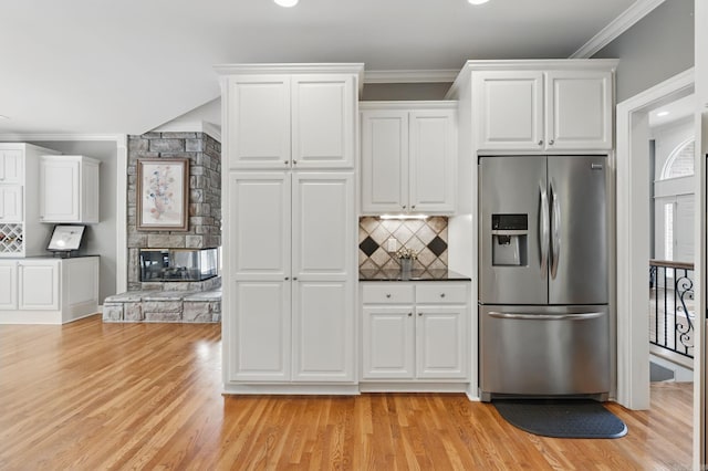 15 Challain Cv, Little Rock, AR 72223 - kitchen featuring stainless steel fridge with ice dispenser, backsplash, light wood-style floors, ornamental molding, and recessed lighting