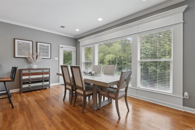 15 Challain Cv, Little Rock, AR 72223 - dining space with wood finished floors, crown molding, baseboards, and recessed lighting