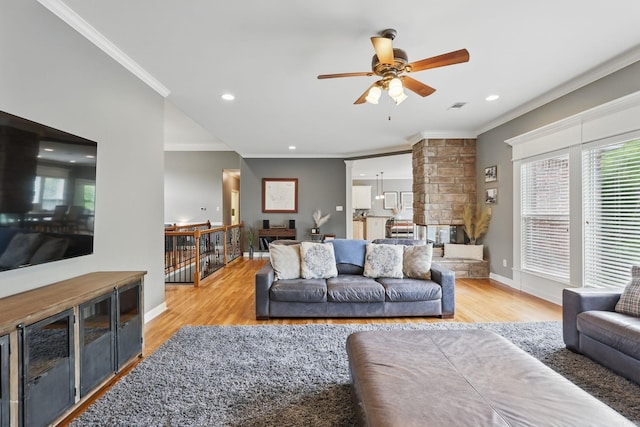 15 Challain Cv, Little Rock, AR 72223 - living area featuring ornamental molding, wood finished floors, ceiling fan, recessed lighting, and baseboards