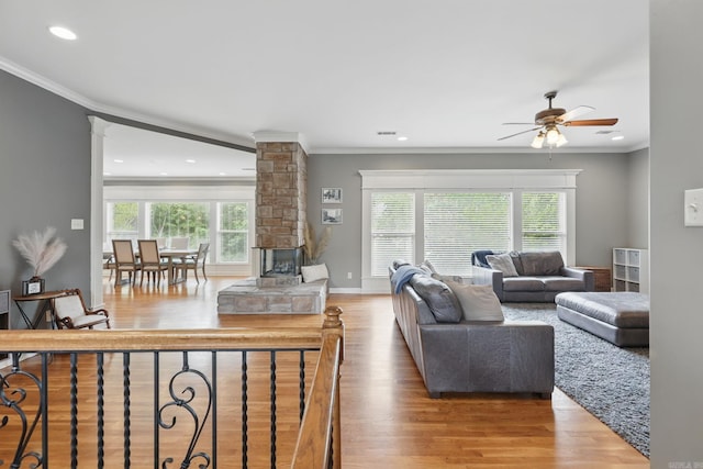 15 Challain Cv, Little Rock, AR 72223 - living area with ornate columns, ceiling fan, wood finished floors, crown molding, and recessed lighting