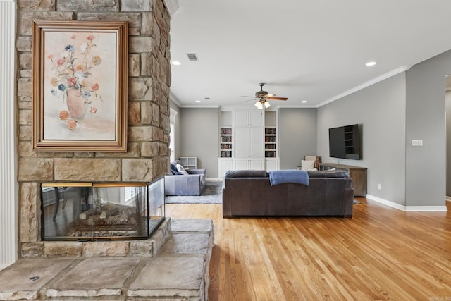 15 Challain Cv, Little Rock, AR 72223 - living area with wood finished floors, ceiling fan, baseboards, crown molding, and recessed lighting