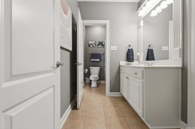 15 Challain Cv, Little Rock, AR 72223 - bathroom with toilet, tile patterned flooring, vanity, and baseboards