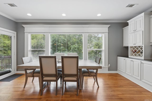 15 Challain Cv, Little Rock, AR 72223 - dining space with plenty of natural light, ornamental molding, light wood-type flooring, and recessed lighting