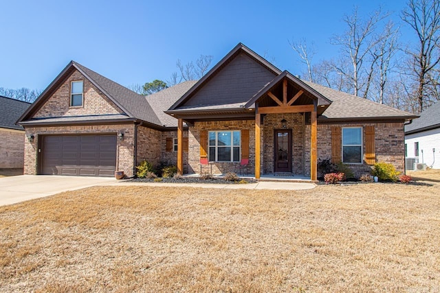 7841 S Shoreline Blvd, Benton, AR 72019 - craftsman-style home with brick siding, driveway, a garage, a shingled roof, and a front yard