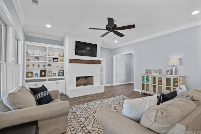 7841 S Shoreline Blvd, Benton, AR 72019 - living area featuring ceiling fan, dark wood-style floors, recessed lighting, crown molding, and a fireplace