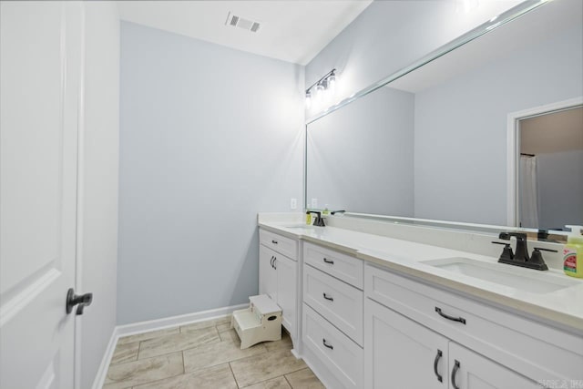 7841 S Shoreline Blvd, Benton, AR 72019 - bathroom featuring double vanity and baseboards