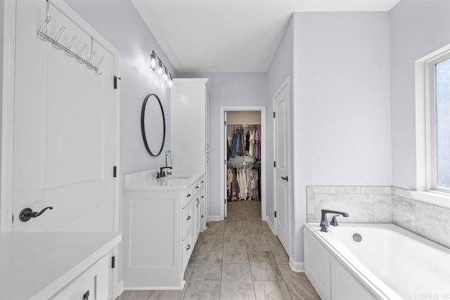 7841 S Shoreline Blvd, Benton, AR 72019 - full bath featuring vanity, plenty of natural light, marble finish floors, and baseboards